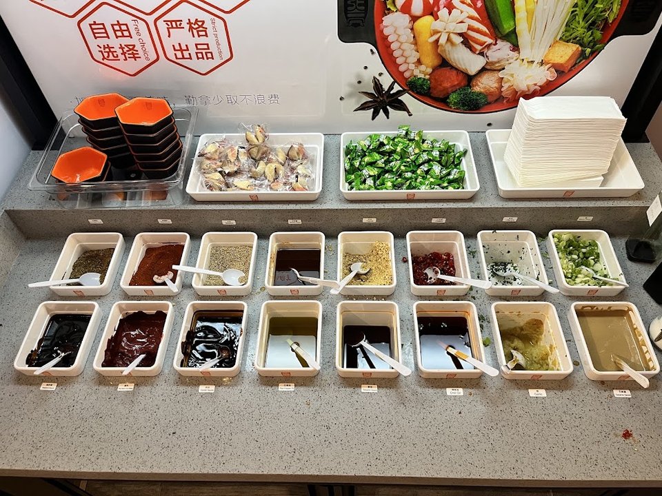 Restaurant menu showing customizable spicy broth dishes.